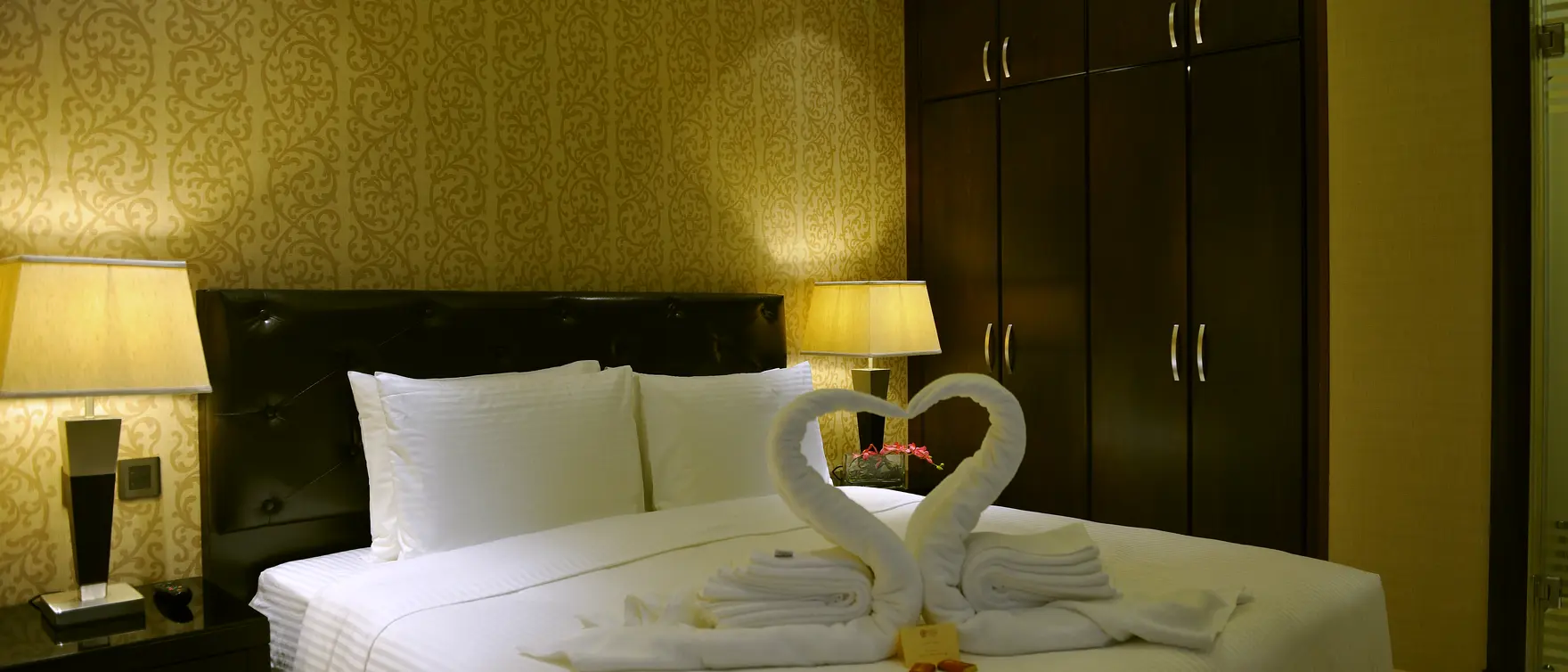 A bedroom inside a Suite Inn suite