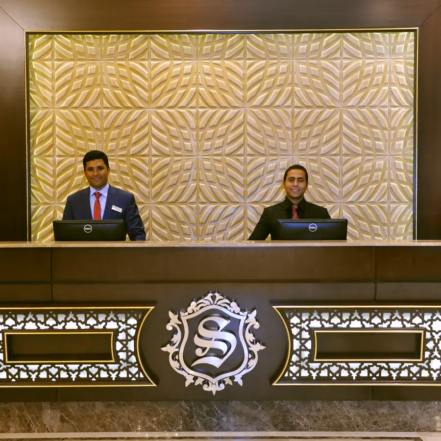 The reception desk and the hotel crest